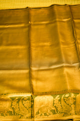 Gold fabric with elephant and paisley patterns