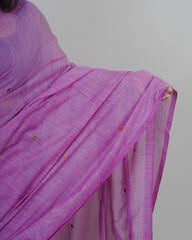 Purple saree with gold accents on a plain background