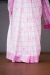 Pink and white checkered fabric with heart patterns on a dark background. laaki
