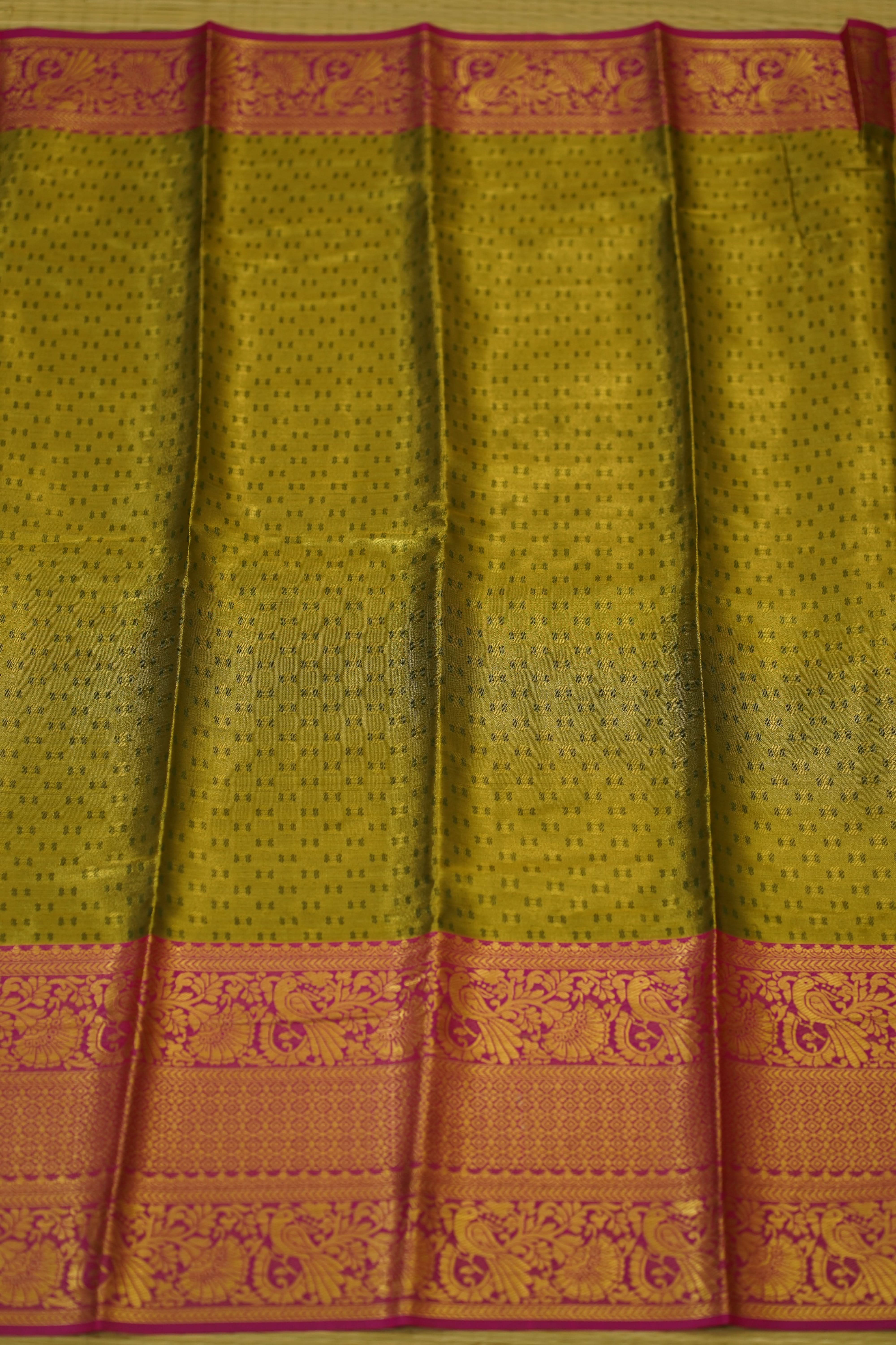 Saree with a green and orange patterned border