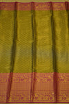 Saree with a green and orange patterned border
