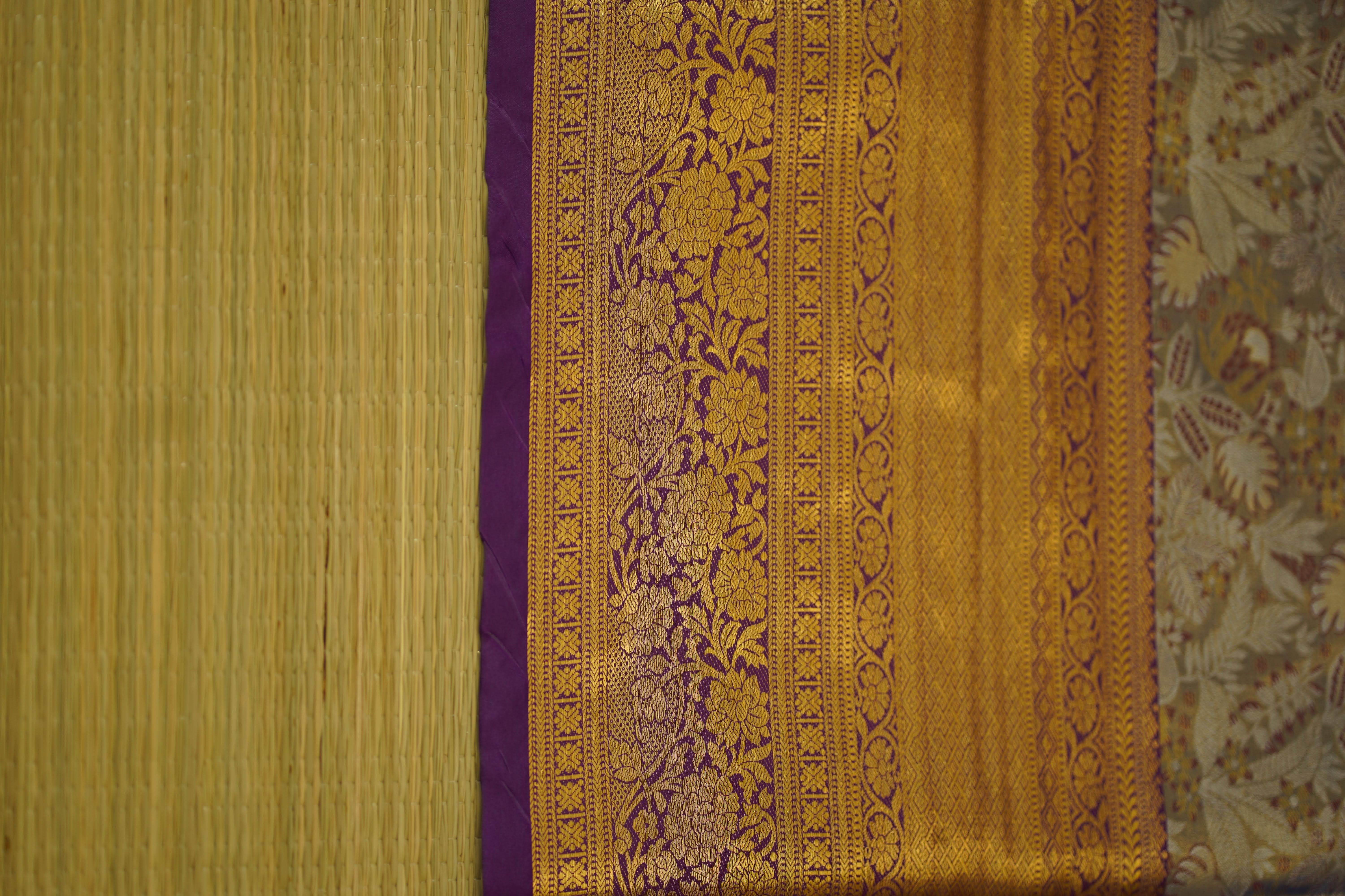 Decorative fabric with intricate patterns on a textured background