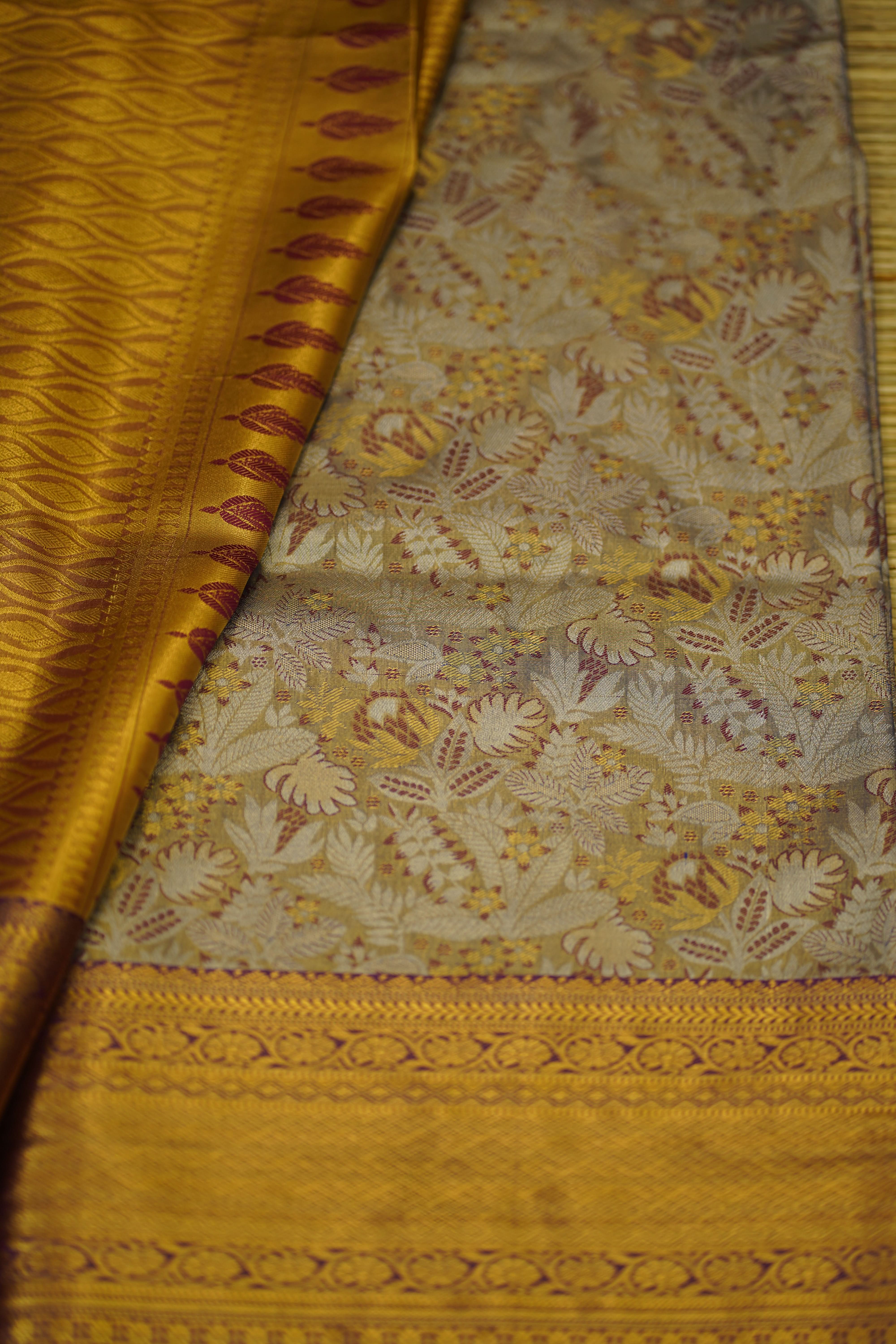 Close-up of a patterned fabric with gold and beige colors