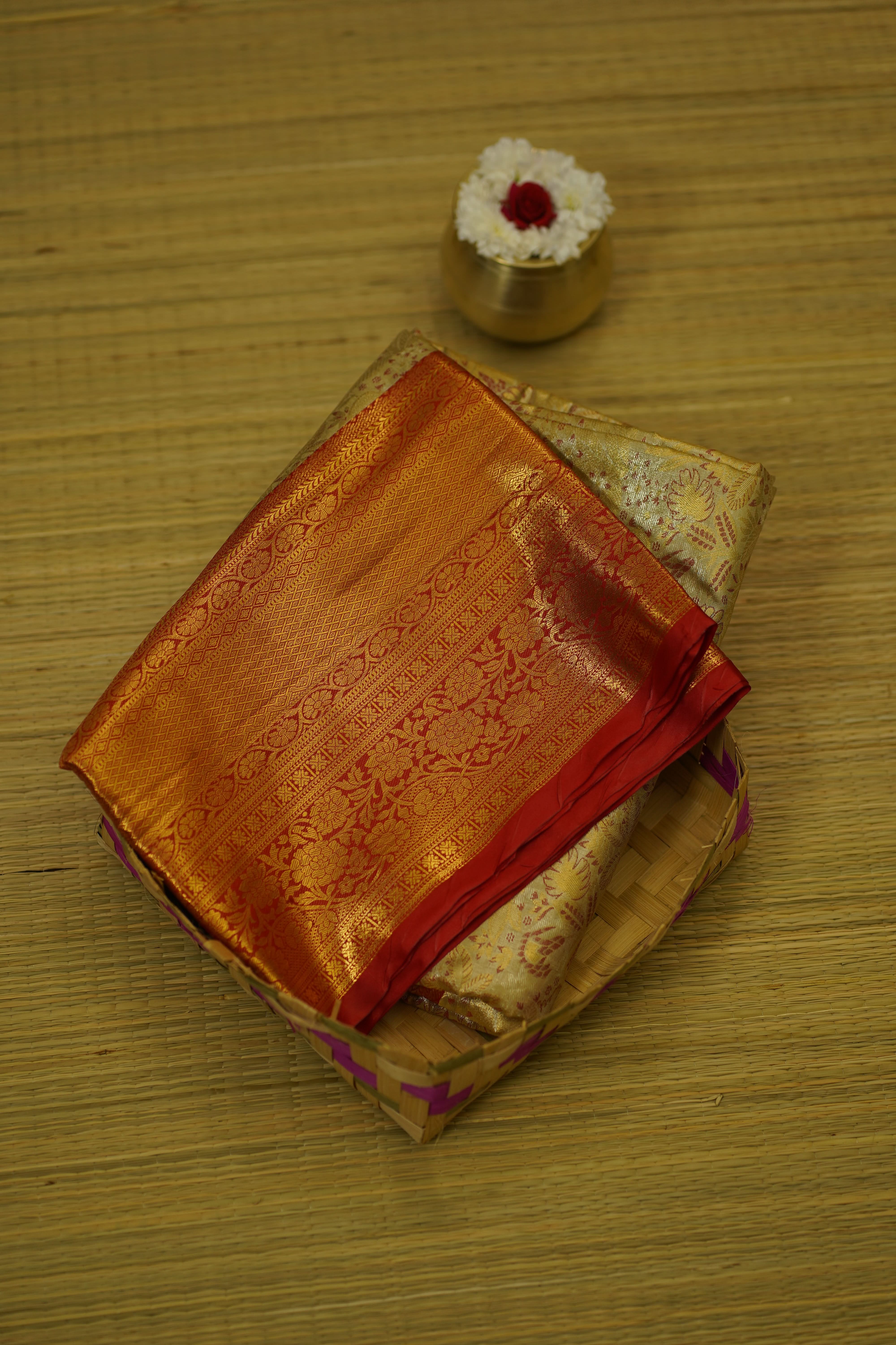 Traditional fabric with intricate patterns on a wooden surface