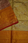 Close-up of patterned fabric with gold and red border