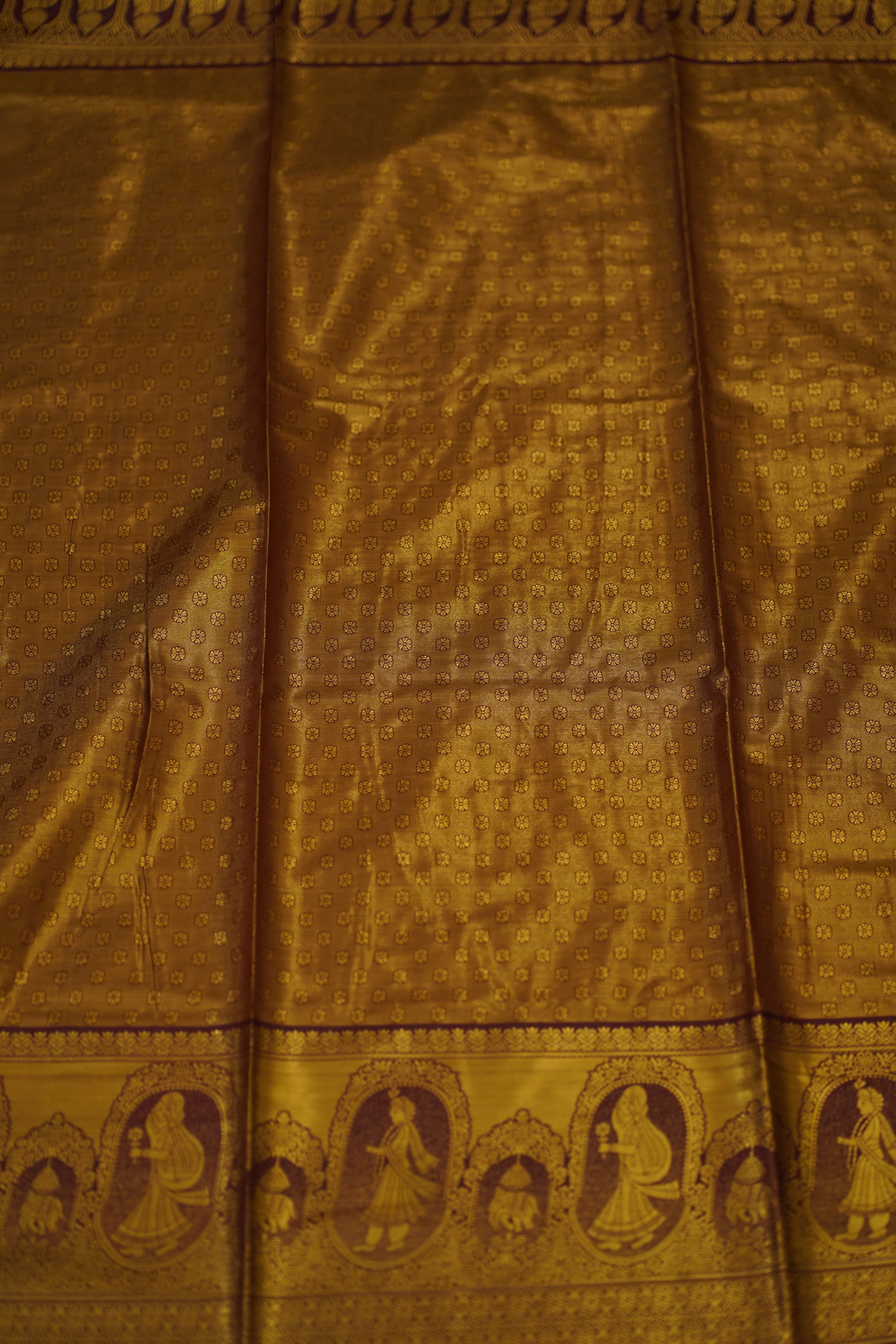 Close-up of gold fabric with intricate patterns