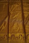 Close-up of gold fabric with intricate patterns