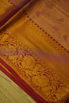 Close-up of a patterned fabric with intricate designs on a wooden surface