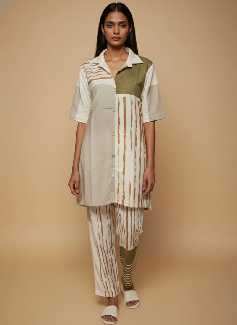 laaki Woman wearing a patterned outfit on a beige background