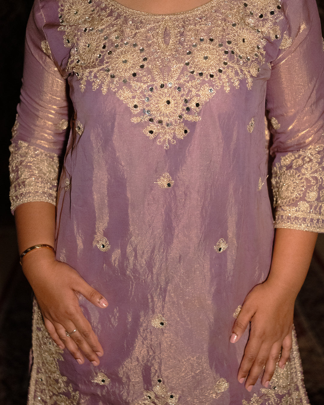 Purple outfit with gold embroidery and embellishments