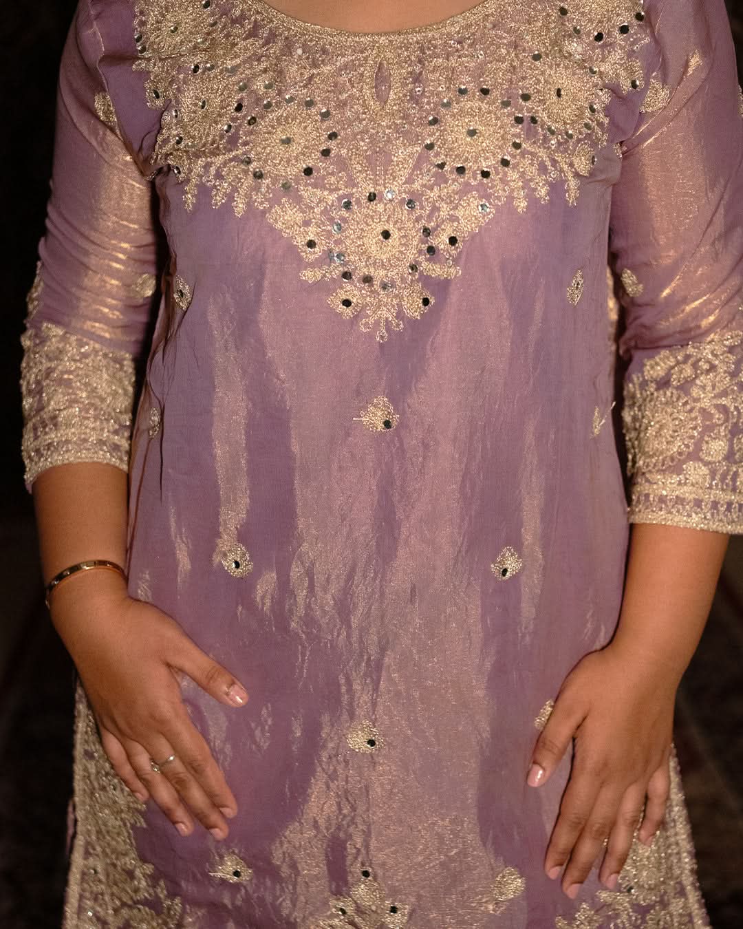 Purple outfit with gold embroidery and embellishments